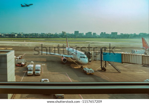 New Delhi,October,5,2014:Air India\
Passanger Aircraft parked connected to aero bridge for passangers\
boarding at New Delhi air terminal ,\
India,Asia\
\
