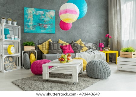 New design grey living room with colorful details and window