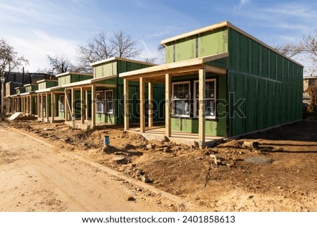 New development of affordable Tiny House village with porches in East Baltimore
