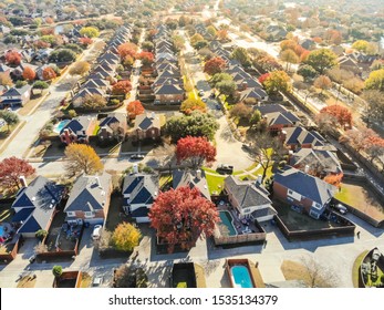 New Development Neighborhood Near Dallas, Texas With Colorful Orange Autumn Leaves. Row Of Two Story Single Family Dwelling With Large Backyard, Swimming Pool, Attached Garage And Wooden Fence Garden