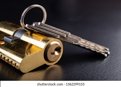 A new door lock on a dark background. A patent and keys to secure the front door. A black background. - Shutterstock ID 1362299153