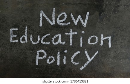 New Education Policy Phrase Written On Blackboard With White Chalk