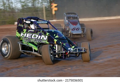 New Egypt, NJ, USA - April 30, 2022: Race Driver Heidi Hedin Leads Rob Ward In A Sprint Car Race At New Egypt Speedway In New Jersey. Slightly Blurred To Depict Action.