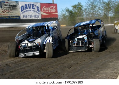 New Egypt, NJ, USA - May 1, 2021: Dirt Track Racers Sarah Napora And Ryan Simmons Collide During Stock Car And Sprint Car Races At New Jersey's New Egypt Speedway.  