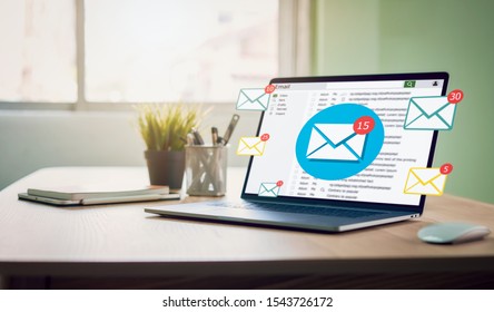 New email alert on laptop, communication connection message to global letters in the workplace. - Shutterstock ID 1543726172