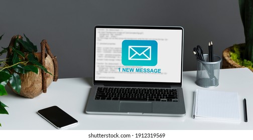 New Email Message Notification On Laptop Screen, Computer Standing On Desk At Workplace In Modern Office. E-Mail Letter, Online Business Communication Background, No People. Panorama