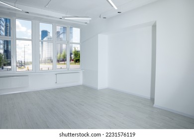 New empty room with clean windows and wall niche