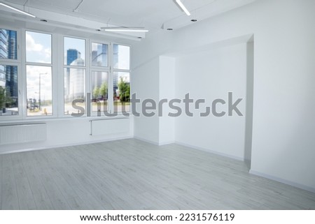 New empty room with clean windows and wall niche