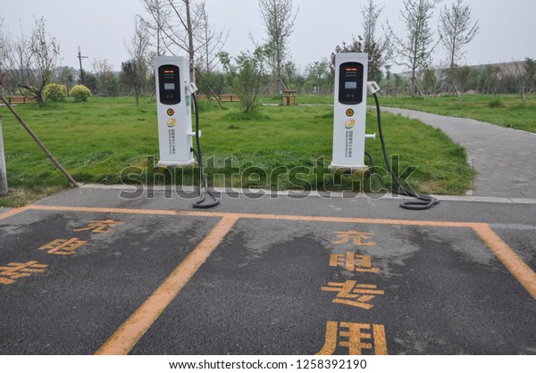 New energy electric\
cars are charged in zhengding county, shijiazhuang, hebei province,\
China, July 7, 2018.