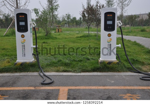 New energy electric\
cars are charged in zhengding county, shijiazhuang, hebei province,\
China, July 7, 2018.