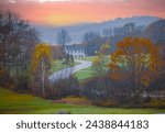 A new England colonial style house at the end of a curved entry drive in central Vermont