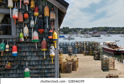 New England Lobster Fishing Dock:  Marker Buoys For Lobster Traps Decorate The Side Of A Fishing Shack On A Wharf In Maine.
