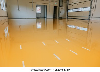 New epoxy floor in warehouse factory. Construction series