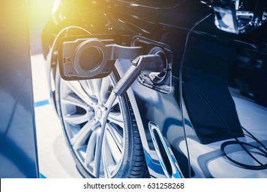 New era of vehicle fuel charge. Battery Power charging of blue modern electric car
