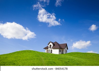 New family house on green field with blue sky