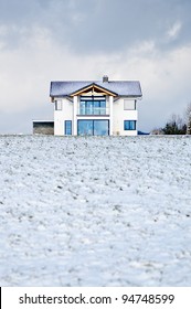 New Family House In A Winter Meadow