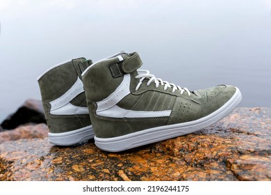 New Fashionable High Youth Sneakers On A Stone Background