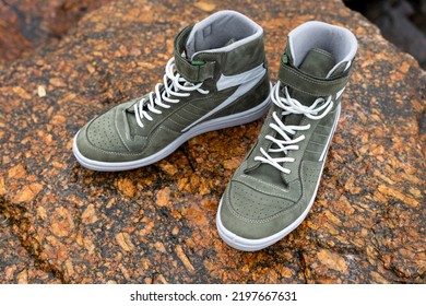 New Fashionable High Youth Sneakers On A Stone Background