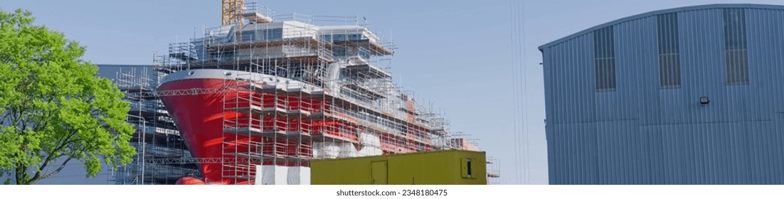 New ferry in construction using crane and scaffolding at Port Glasgow