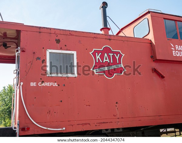 New Franklin, MO United\
States of America - September 13th, 2021 : Detail view of Katy\
caboose parked in New Franklin, near converted rail depot on the\
Katy Trail.