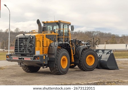New Front Wheel Loader Machine at Road Construction Site