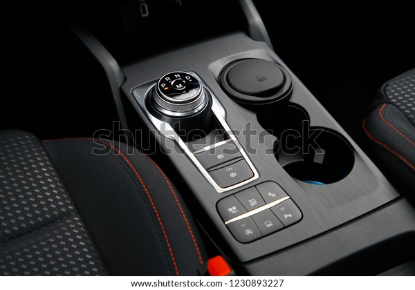 The new generation of a\
modern car\'s circular automatic gear and driving control support\
buttons.