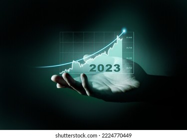 New Goals, Plans and Visions for Next Year 2023. Businessman draws increase arrow graph corporate future growth year 2022 to 2023. Planning,opportunity, challenge and business strategy. - Shutterstock ID 2224770449