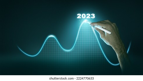 New Goals, Plans and Visions for Next Year 2023. Businessman draws increase arrow graph corporate future growth year 2022 to 2023. Planning,opportunity, challenge and business strategy. - Shutterstock ID 2224770633