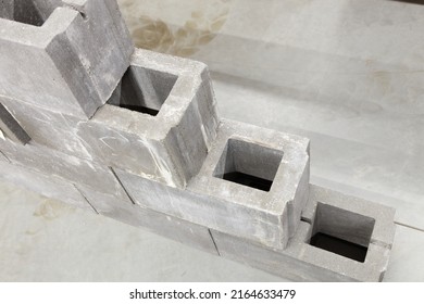 New gray concrete ventilated  wall blocks close up in stack. Building materials production storage and retail - Shutterstock ID 2164633479