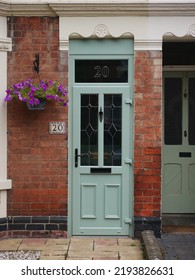 New Green Door With Hanging Basket On Edwardian House On Suburban UK Street