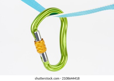 New green  HMS  carabiner, screw lock snap hook, climbing  equipment  on  sewn loop sling on white background