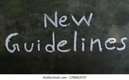 New Guidelines Phrase Written On Blackboard With White Chalk