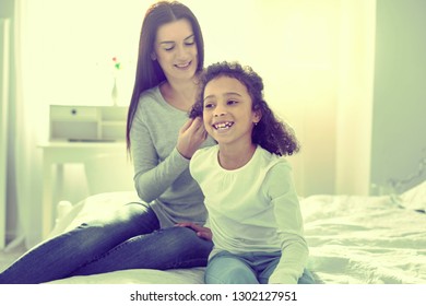 New hairstyle. Little happy child enjoying her day with her mom. - Powered by Shutterstock