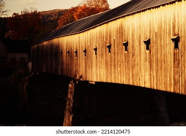 A New Hampshire Covered Bridge Bathed In Late Day Light.