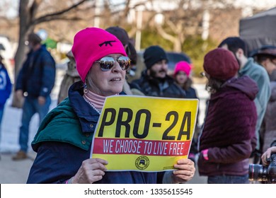 New Hampshire Gun Rights Rally at the Capital House in Concord, NH.  Saturday, March 9, 2019. A woman is holding a Pro constitutional Amendment 2 sign