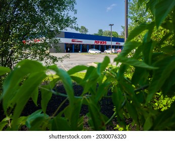 New Hartford, New York - July 5, 2021: View Of Pep Boys Auto Parts Store And Tire Service Department With Cars Inside The Garage