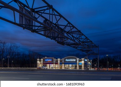 New Hartford, New York - Mar 19, 2020: Night View Of WellNow Urgent Care, Formerly Five Star Urgent Care And Aspen Dental Management, ADMI, Which Is A Dental Office In Upstate New York.