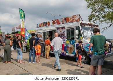 New Haven, CT, US-September 6, 2022: People Line Up For Mexican And Latin American Food At Food Trucks Food Truck Paradise Area.