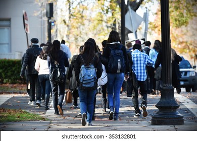 NEW HAVEN, USA - NOV 14, 2015: People Walk Along A Beautiful Tree Lined Path On The Campus Of Yale University. Founded In 1701 The Ivy League College Has An Enrolment Of Over 12,000 Students.