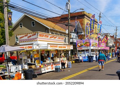 New Holland, PA, USA - October 2, 2021: Multiple Food And Game Stands Open At The Annual Community Street Fair In A Small Community In Lancaster County, PA.