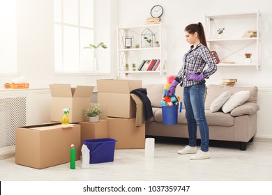 New Home Cleaning Young Woman Tiding Up After Moving To New Appartment Girl With New Home Cleaning Young Woman Tiding Up After Moving To New Appartment Girl With
