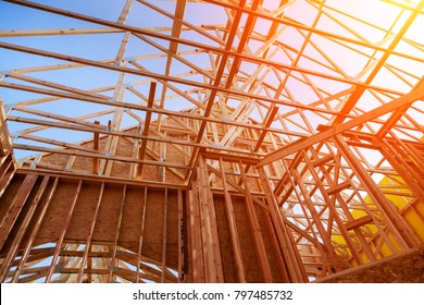 New home construction. build with wooden truss, post and beam framework. - Shutterstock ID 797485732