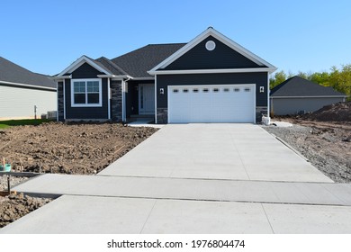 New Home Driveway Construction with a Concrete Cement Foundation by Builders for a Smooth Surface - Shutterstock ID 1976804474