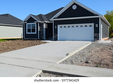 New Home Driveway Construction with a Concrete Cement Foundation by Builders for a Smooth Surface - Shutterstock ID 1977341429