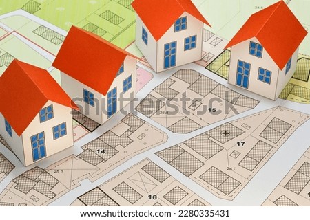 New home and free vacant land for building activity - Construction industry and building permit concept with a residential area, cadastral map, General Urban Planning and zoning regulations   Imagine de stoc © 