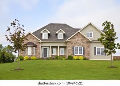 A new home with a landscaped yard.
