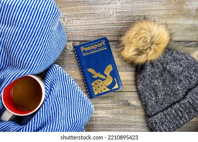 New Hope, Minnesota - October 6, 2022: Flatlay Travel Vacation Concept To The US National Parks, For Winter Trips. National Park Passport Book, Hat, Coffee Cup And A Blue Blanket