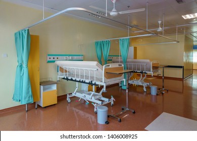 New Hospital Patient Ward Or ICU Intensive Care Unit With Empty Bed Room Interior For Nursing Care And Health Treatment.