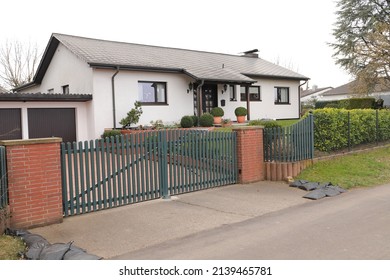 A New House With A Driveway Gate 