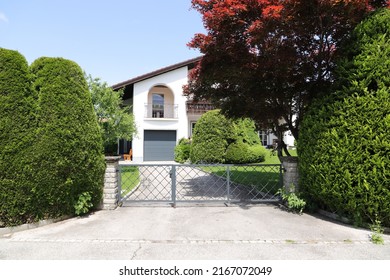 A New House With A Driveway Gate 